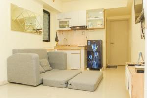Cozy Living and Tidy 1BR Meikarta Apartment By Travelio
