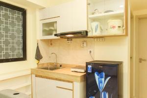 Cozy Living and Tidy 1BR Meikarta Apartment By Travelio