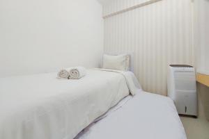 Comfort 2BR Apartment at Bassura City By Travelio