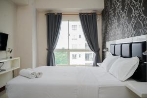 Modern and Nice 2BR Apartment Scientia Residence By Travelio