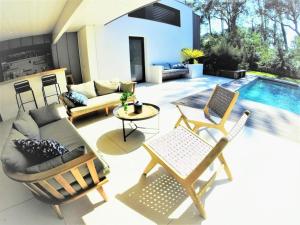 Villa dArchitecte avec Piscine Chauffée, Terrasse et Services Hôteliers à Soorts-Hossegor - FR-1-791-11