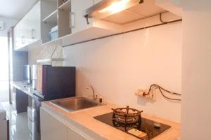 Compact and Cozy Studio Apartment at Orchard Supermall Mansion By Travelio