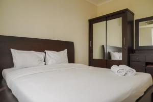 Cozy Stay 1BR at Maple Park Sunter Apartment By Travelio