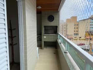 Apartamento a 100m da Praia Grande, churrasqueira, piscina e wi fi
