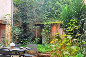 Maisons de vacances Le Patio - Cinelodge avec jardin : photos des chambres