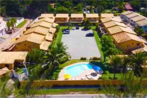 Casa em condomínio com lazer de frente para praia