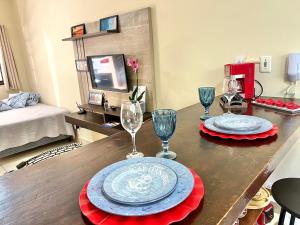 Studio pé na areia com área de churrasco privativa