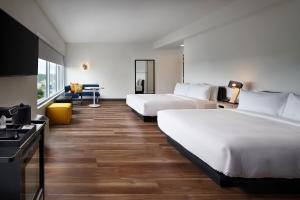 Larger Queen Room with Two Queen Beds (No Resort Fee) room in Aloft Orlando International Drive