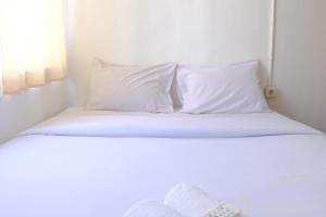 Cozy 2BR at Jarrdin Cihampelas Apartment By Travelio