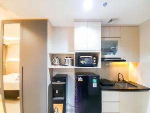 Modern Look and Comfortable Studio at Patraland Amarta Apartment By Travelio