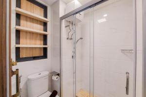 Spacious and Homey 2BR at Sky House BSD Apartment By Travelio