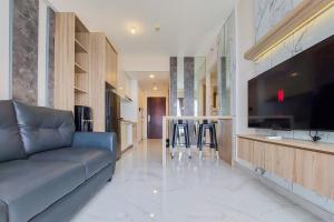 Spacious and Homey 2BR at Sky House BSD Apartment By Travelio