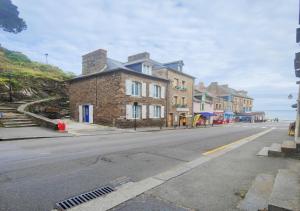 Appartements La Belle Mer by MRODBNB - Appart Neuf - Apercu Mer - 25m Plage & Resto - Cine - Cheminee - Popcorn : photos des chambres