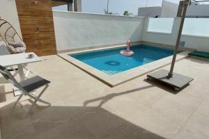 Casa LaryLen is a modern Holiday Home with Private Pool & Rooftop Near the Beach