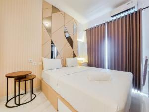 Homey and Cozy Studio Sky House BSD Apartment near AEON By Travelio