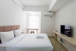 Modern Studio at Barsa City Apartment By Travelio