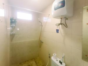 Modern 2BR Green Pramuka City Apartment near Shopping Center By Travelio