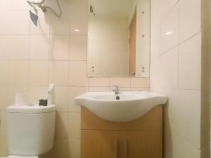 Modern 2BR Green Pramuka City Apartment near Shopping Center By Travelio