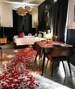 Appartements Suite Passion - Jacuzzi prive - Table massage : photos des chambres