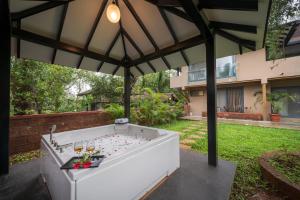 SaffronStays Red Brick House - 3BR English-style villa with verandah dining, orchard lawn & classic charm