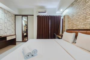 Nice Studio at 18th Floor Atria Residence Gading Serpong Apartment By Travelio