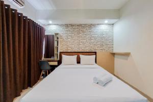 Nice Studio at 18th Floor Atria Residence Gading Serpong Apartment By Travelio