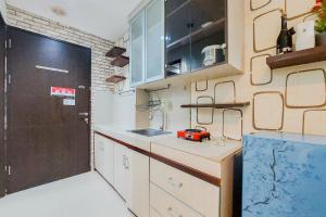 Nice Studio at 18th Floor Atria Residence Gading Serpong Apartment By Travelio