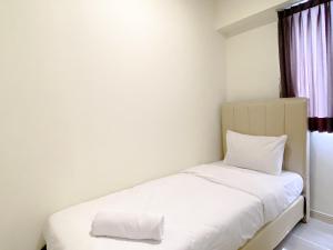 Comfortable 2BR with Working Room at Meikarta Apartment By Travelio