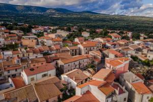Home Slow between Sea and Olive Trees, Terrace and Tranquility in the Village of Seneghe