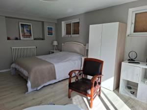 Appartements Appartement au rez-de-chaussee d'une maison : photos des chambres