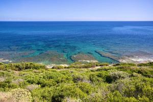 Village in Porto Corallo just 200 meters from the beach, apartments with private outdoor area