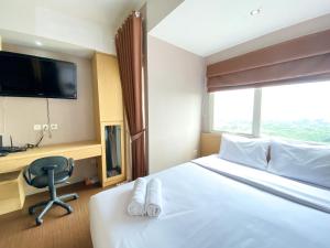 Cozy and Nice Studio at The Oasis Cikarang Apartment By Travelio