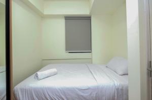 Comfortable 2BR with Workspace at Meikarta Apartment By Travelio