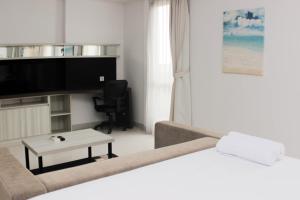 Nice and Comfy Studio Azalea Suites Apartment By Travelio