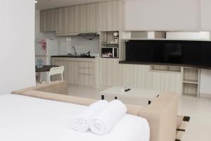 Nice and Comfy Studio Azalea Suites Apartment By Travelio