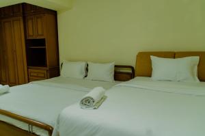 Spacious and Homey 3BR at Kondominium Rajawali Apartment By Travelio