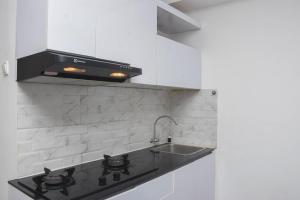 Comfort and Homey Studio at Amethyst Apartment By Travelio