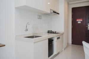 Studio Apartment at Sky House BSD with Cozy Design By Travelio