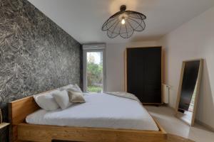 Appartements T2 Jardin cosy et lumineux proche Paris : photos des chambres