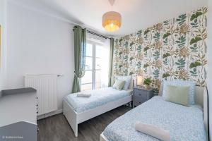 Appartements Le Cartier Appt F3, 7mn Disneyland, Parking,Terrace : photos des chambres