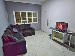 Casa com Piscina Cascata Na Praia Grande