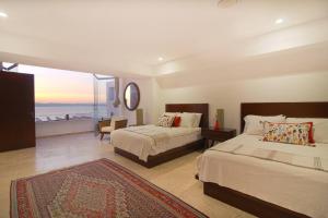 Two-Story Beachfront Oasis