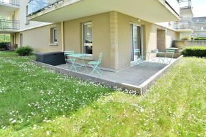 Appartements Escapade - Appartement avec jardin et parking : photos des chambres