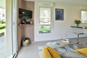 Appartements Escapade - Appartement avec jardin et parking : photos des chambres