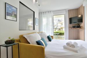 Appartements Escapade - Appartement avec jardin et parking : photos des chambres