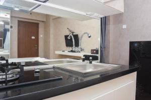 Fancy and Nice Studio at Cinere Resort Apartment By Travelio