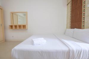 Homey and Comfort Living Studio Room at Bassura City Apartment By Travelio