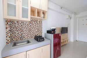 Homey and Comfort Living Studio Room at Bassura City Apartment By Travelio