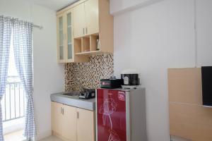 Homey and Comfort Living Studio Room at Bassura City Apartment By Travelio