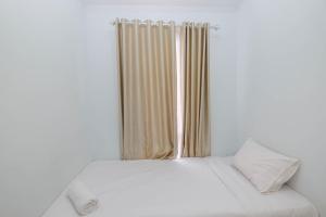 Comfy and Homey 2BR at Patraland Urbano Apartment By Travelio